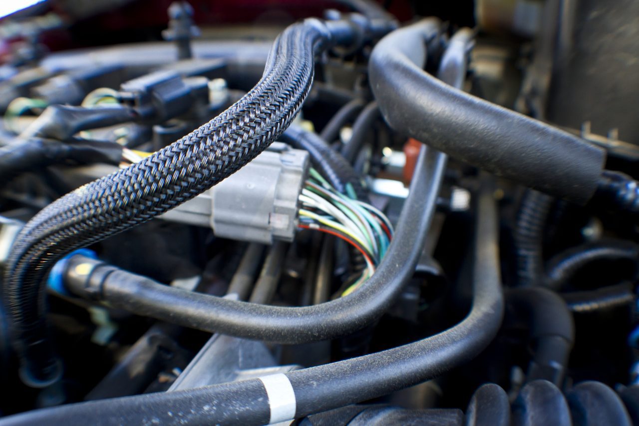 Closeup of Hoses and Wires in an Automobile Engine